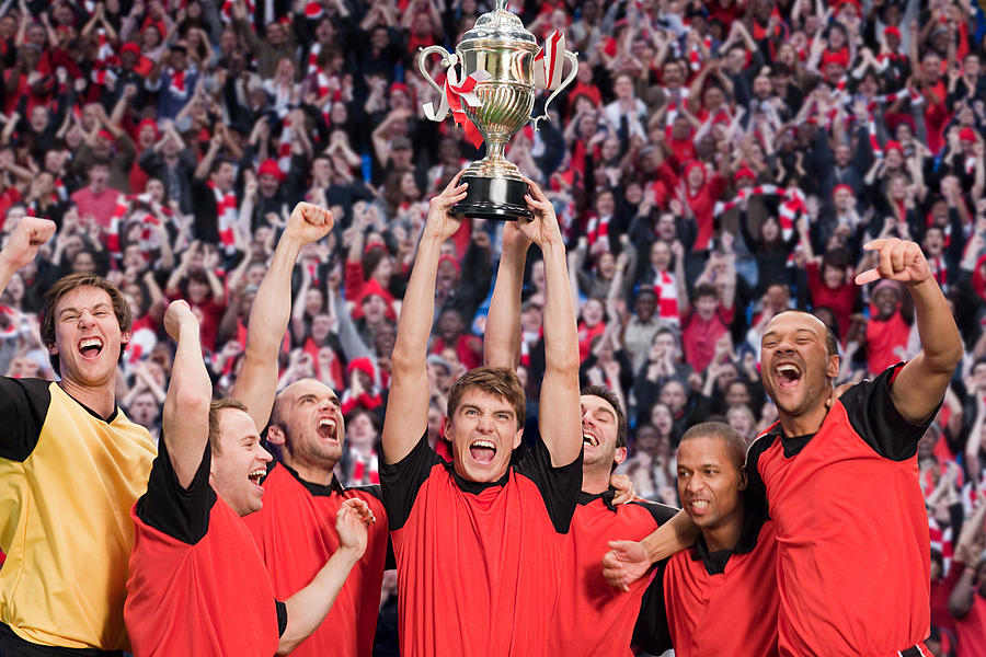Football team winning a trophy Photograph by Image Source