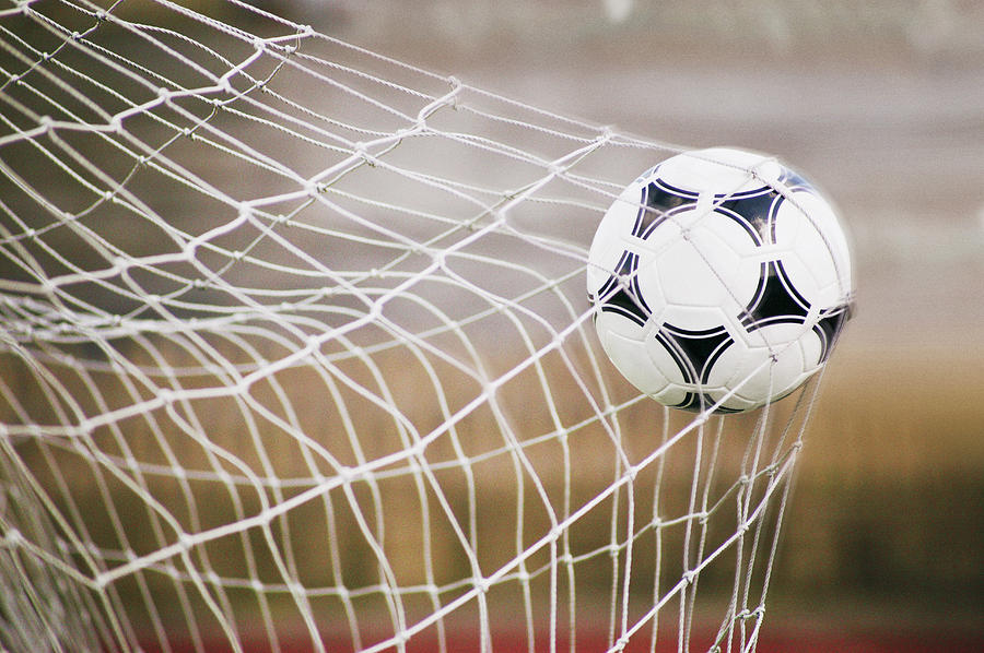 Football Trapped in a Goal Net, Close-Up Photograph by Cocoon