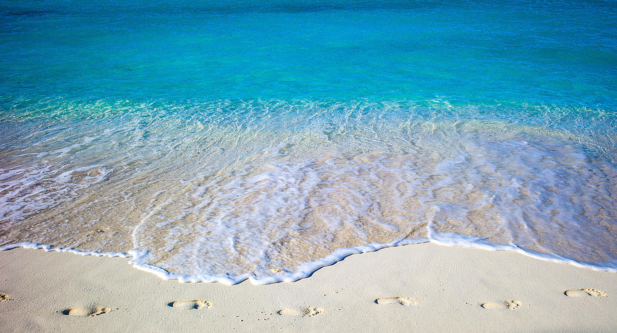 Footsteps in White Sand Along Calming Ocean Waves Photograph by Judith Barath