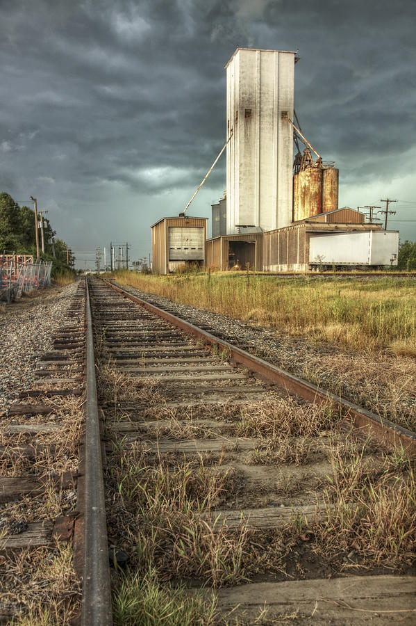 Foreboding Sky Above a Prairie Sentinel - Storm - Railroad Tracks Photograph by Jason Politte