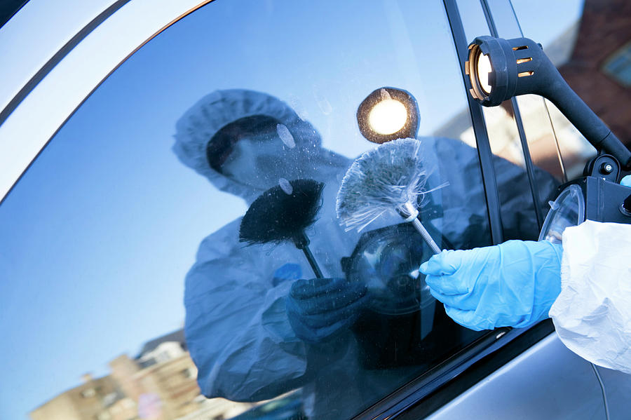 Forensics Officer Collecting Evidence Photograph By Paul Rapson science 