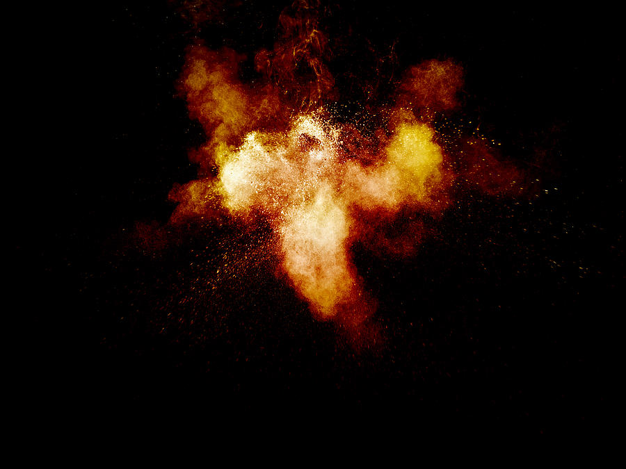 Forms and textures of an explosion of a powder of colors yellow on a black bottom Photograph by Jose A. Bernat Bacete
