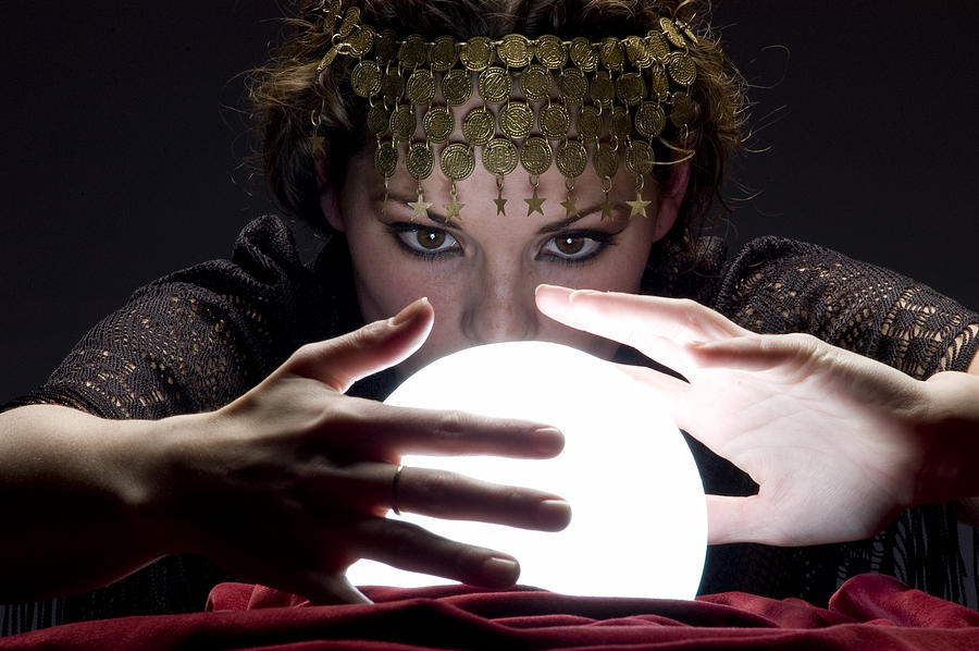 Fortune Teller With Glowing Crystal Ball Photograph by Pidjoe
