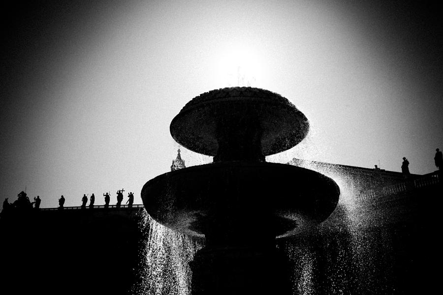 Fountain in Vatican with sun black white Photograph by Raimond Klavins