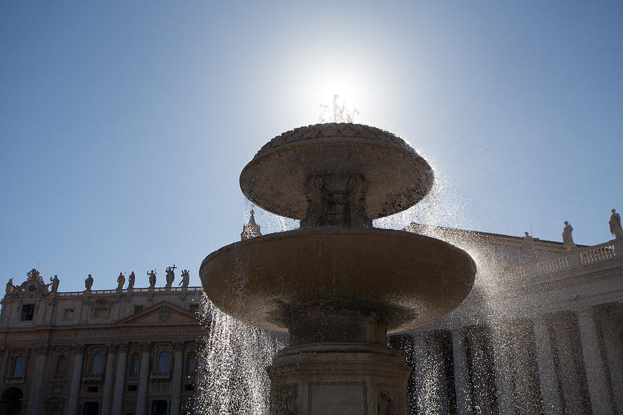 Fountain in Vatican with sun Photograph by Raimond Klavins