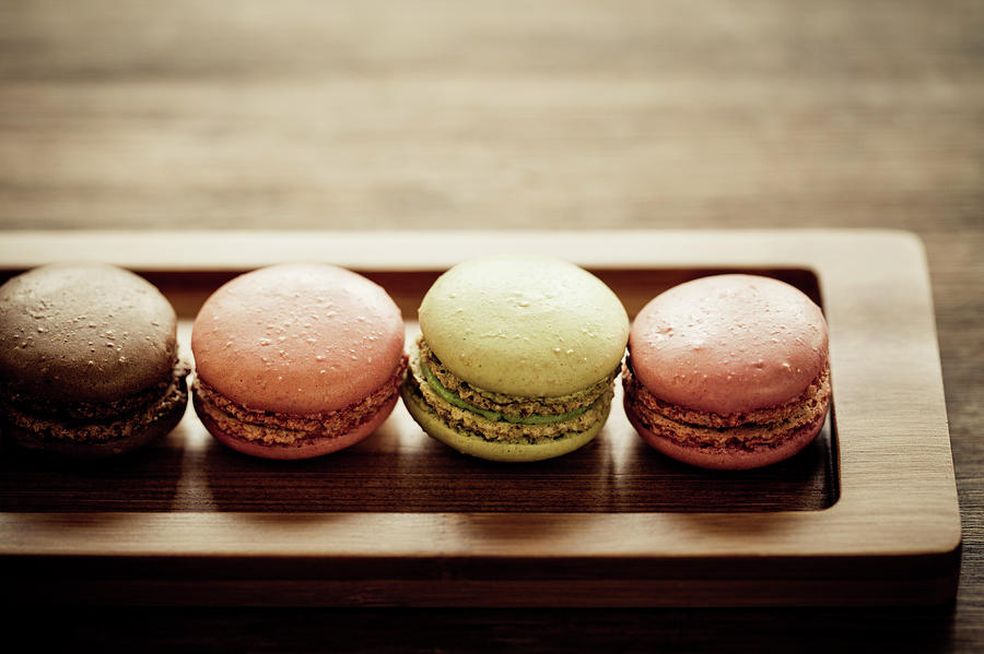 Four Macaroons Lined Up In A Narrow Photograph by Mmeemil