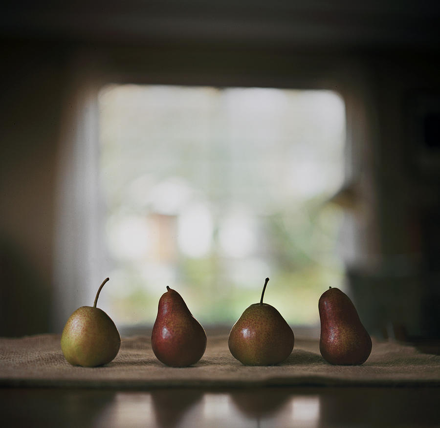 Four Pears On A Table Photograph by Danielle D. Hughson