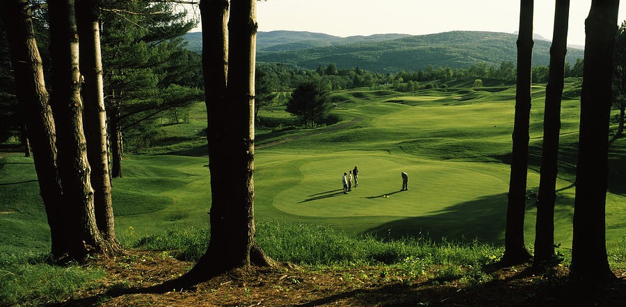 Four People Playing Golf, Country Club Photograph by Panoramic Images