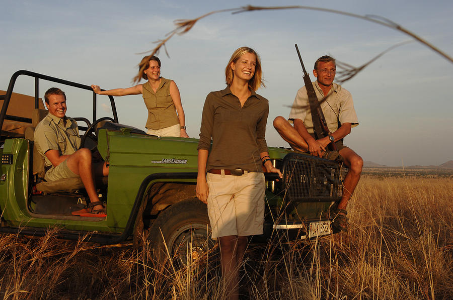 Four People Smiling On Safari Photograph by Peter McBride - Pixels