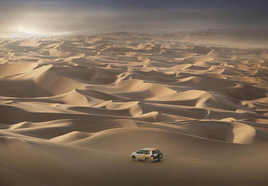 Four-wheel-drive vehicle in the desert Photograph by Buena Vista Images