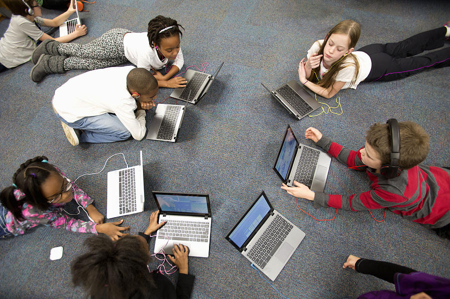 Fourth grade students work on laptops in class. Photograph by Jonathan Kirn
