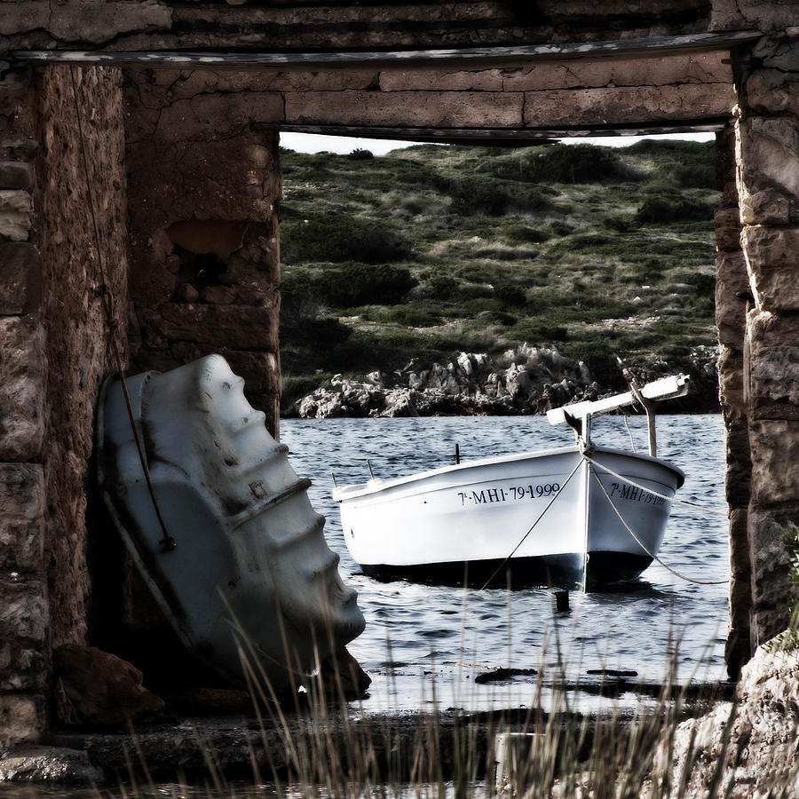 Vintage boat framed in nature - Framed memory Photograph by Pedro Cardona Llambias