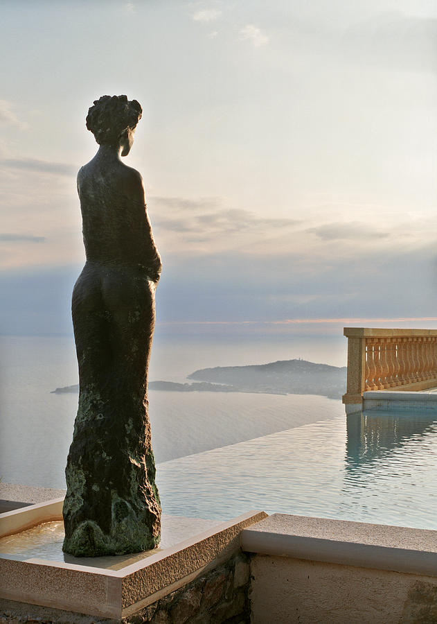 France, Provence, Eze, infinity pool and statue overlooking sea Photograph by Catherine Ledner