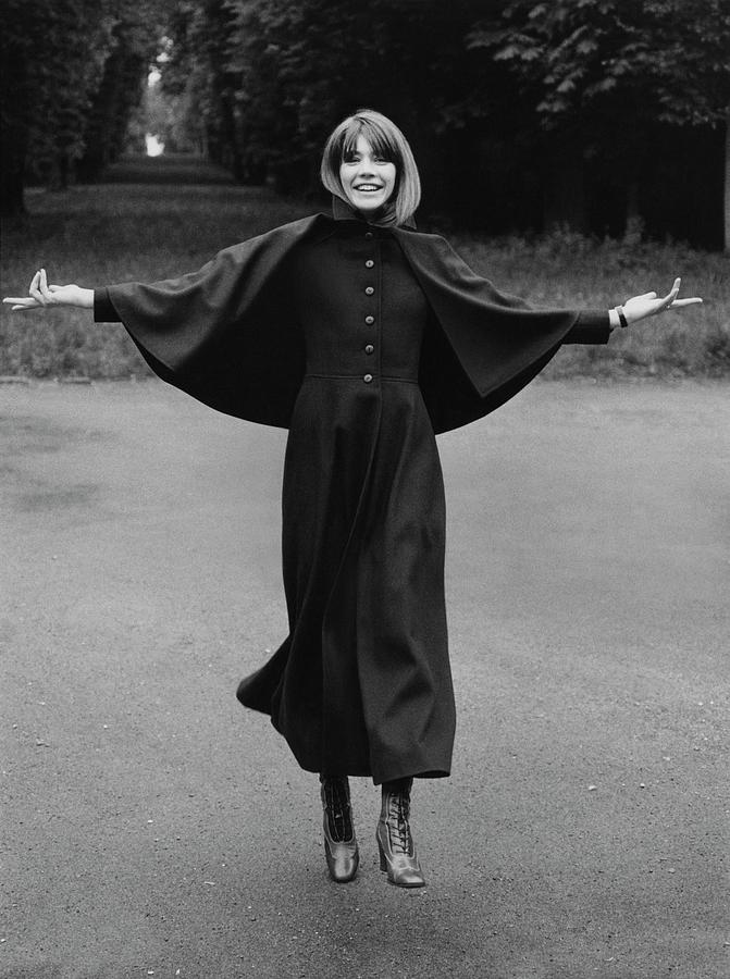 Black And White Photograph - Francoise Hardy Wearing A Coat With A Small Cape by Arnaud de Rosnay