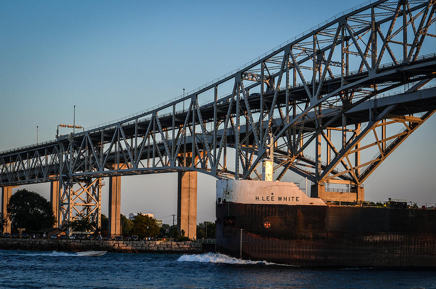 Freighter Going Under Bridge At Sunset Photograph By Brittany Collins 