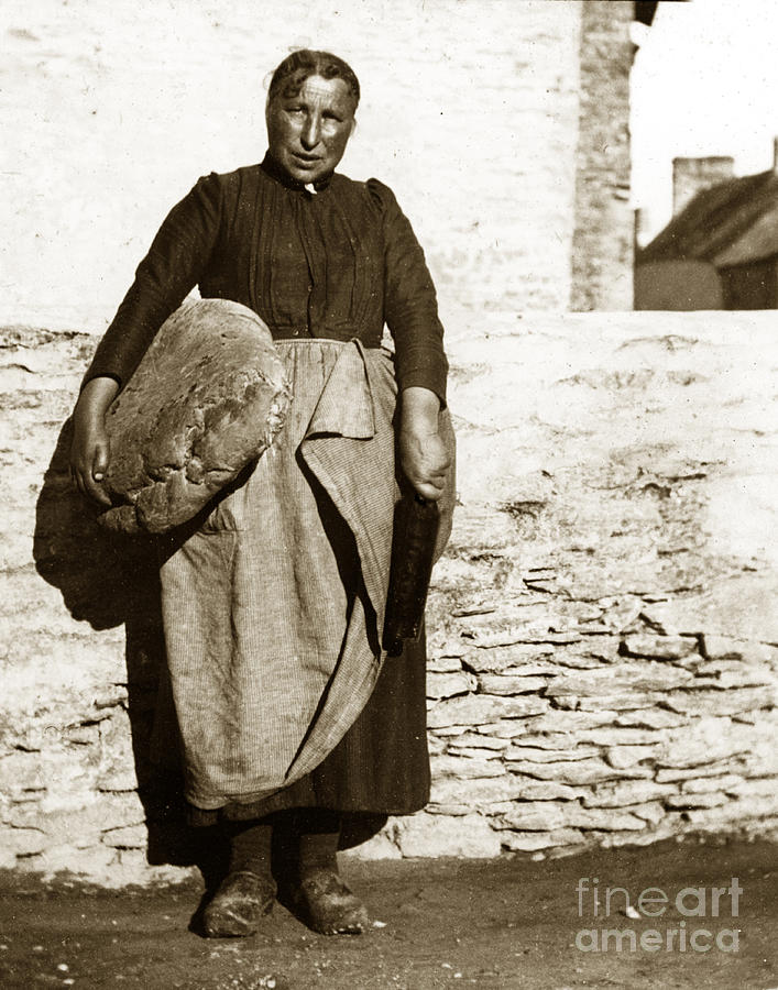 Bread Photograph - French Lady with a very large Bread France 1900 by Monterey County Historical Society