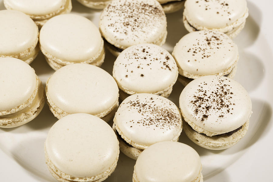 French Macaroons lined up in a dish Photograph by Jean-Marc PAYET