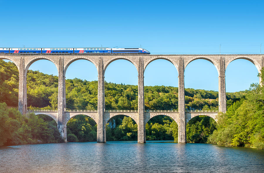 French TGV train on stone viaduct in Rhone-Alpes France Photograph by Gregory_DUBUS