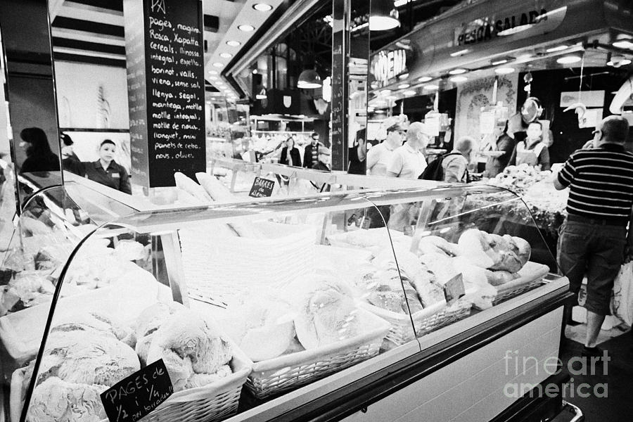 Barcelona Photograph - fresh artisan bread for sale inside the la boqueria market in Barcelona Catalonia Spain by Joe Fox