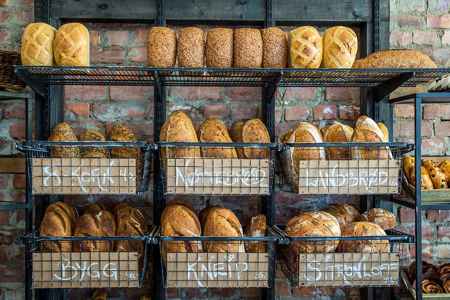 Bread Photograph - Fresh baked bread at small town bakery  by Aldona Pivoriene