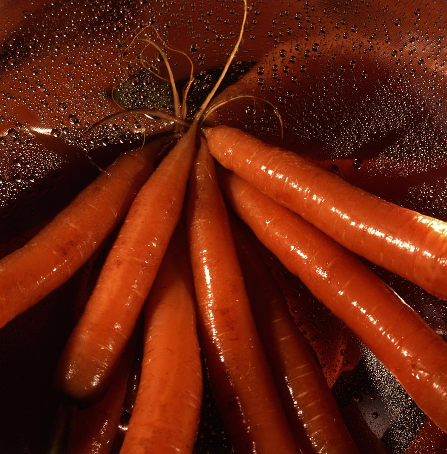 Fresh carrots in a colander Photograph by Ulrich Kunst And Bettina Scheidulin