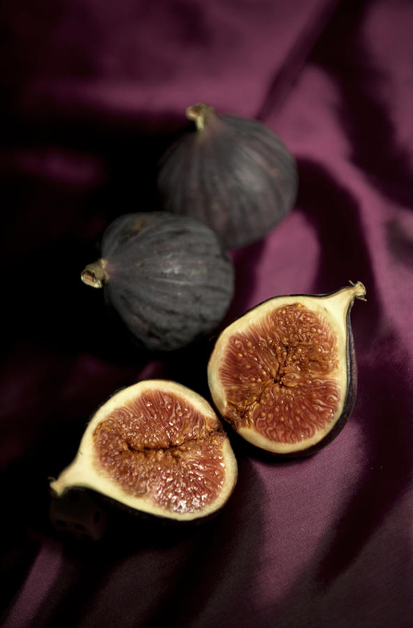 Fresh figs on violet fabric Photograph by Jaroslaw Blaminsky