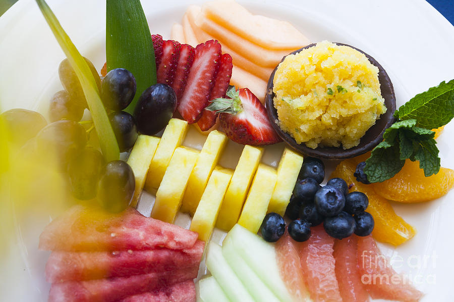Fresh fruit on a white plate. Photograph by Don Landwehrle