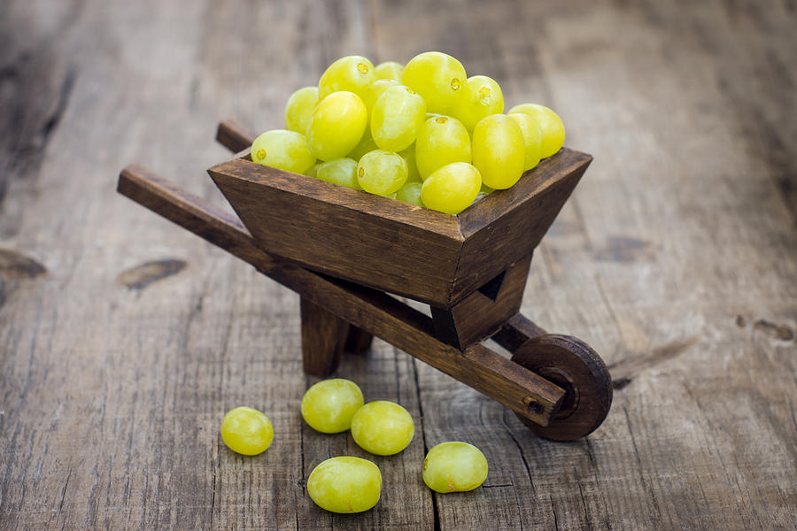 Grape Photograph - Fresh Green Grapes in a wheelbarrow by Aged Pixel