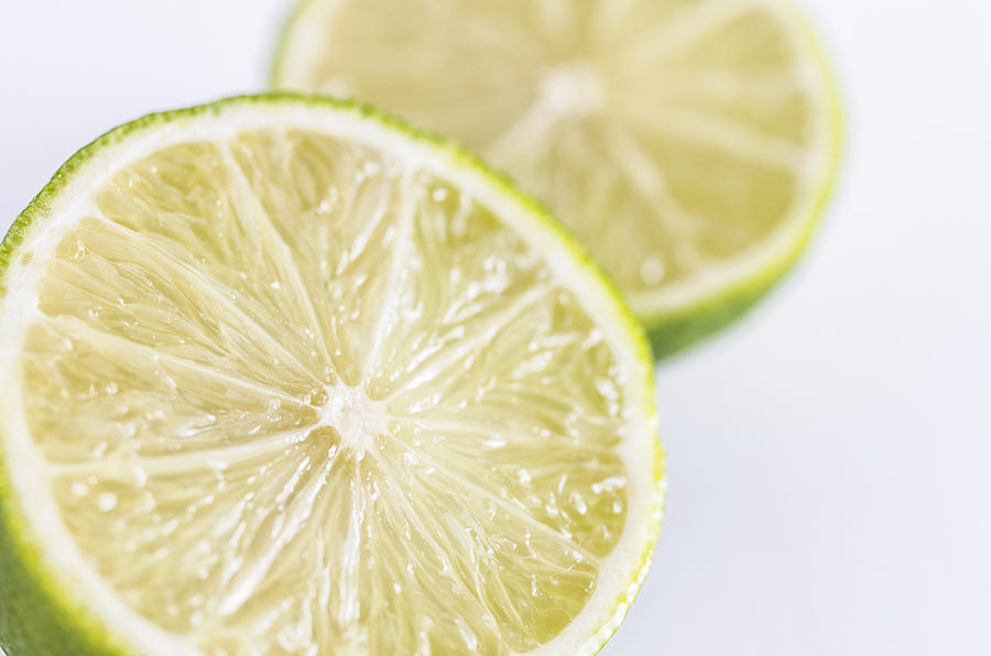 Fresh limes Photograph by Paulo Goncalves