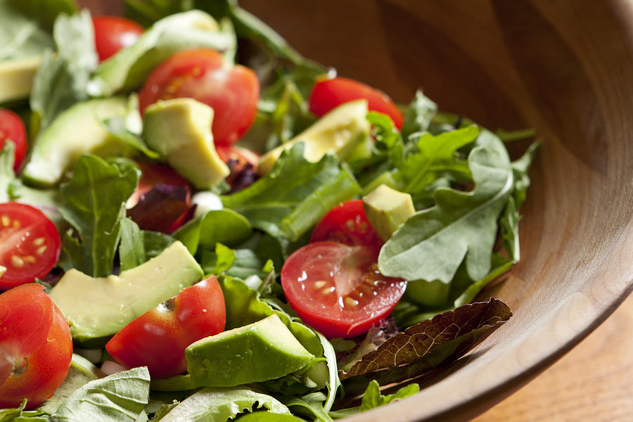 Fresh salad with cherry tomatoes, avocado and mixed greens Photograph by Boblin