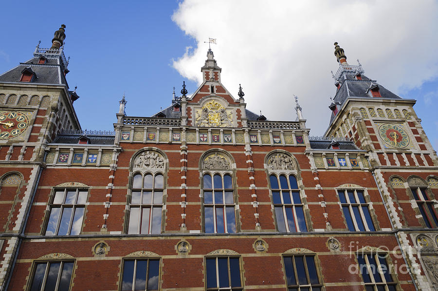 Front facade of the Amsterdam Central Railway Station Photograph by Oscar Gutierrez