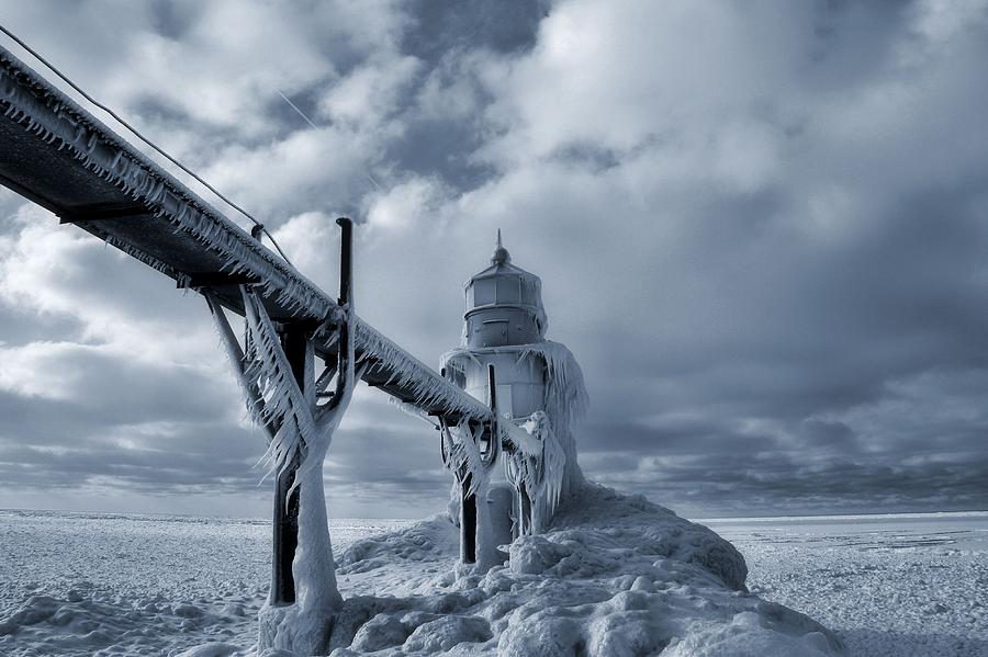 Frozen Lighthouse In Saint Joseph Michigan Photograph by Dan Sproul