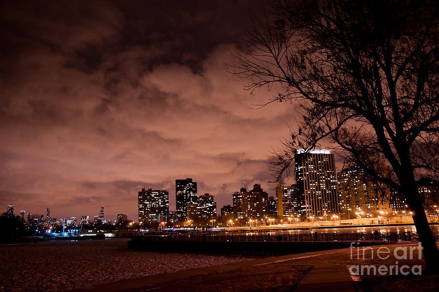 Chilled Nocturne - Night View of Frozen Lake Michigan and Dark Clouds over Chicago Downtown Photograph by Dejan Jovanovic