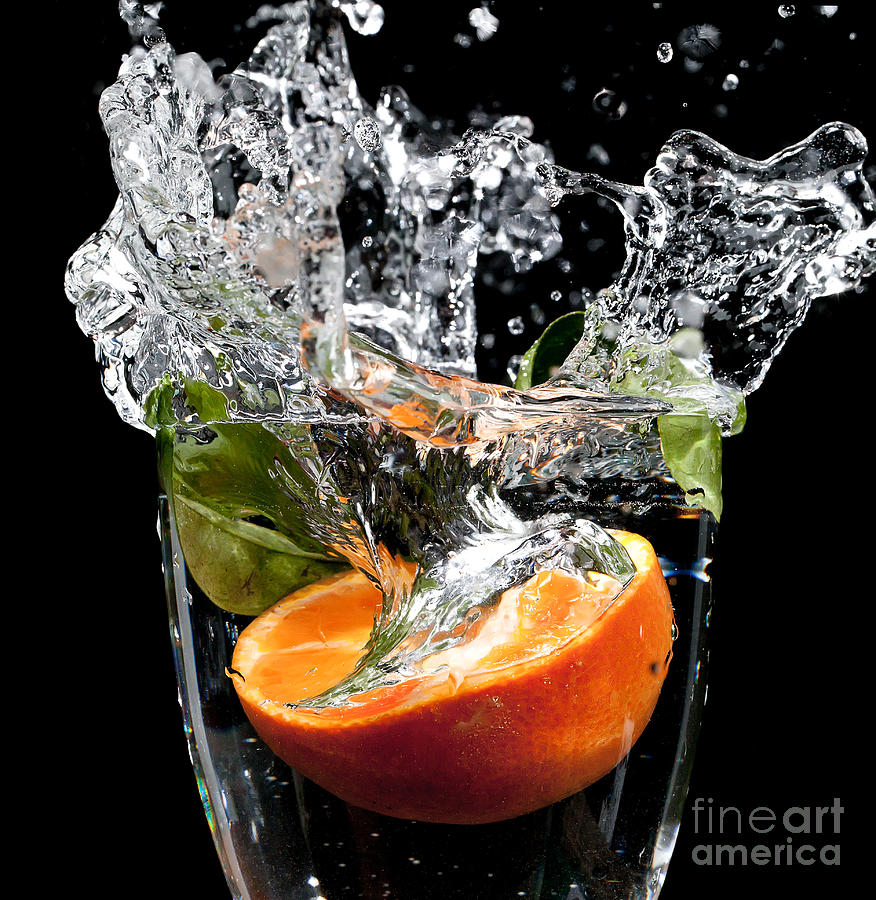 Fruit drop with big splash Photograph by Simon Bratt
