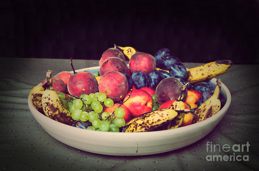 Fruit on plate Photograph by Perry Van Munster