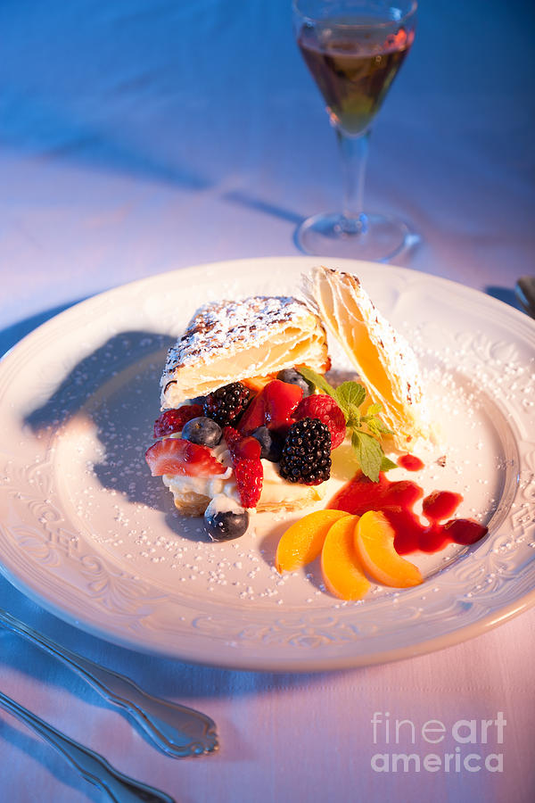 Fruit pastry on a white plate. Photograph by Don Landwehrle