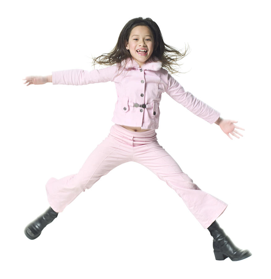 Full Body Shot Of A Female Child As She Jumps Up Playfully Through The Air Photograph by Photodisc