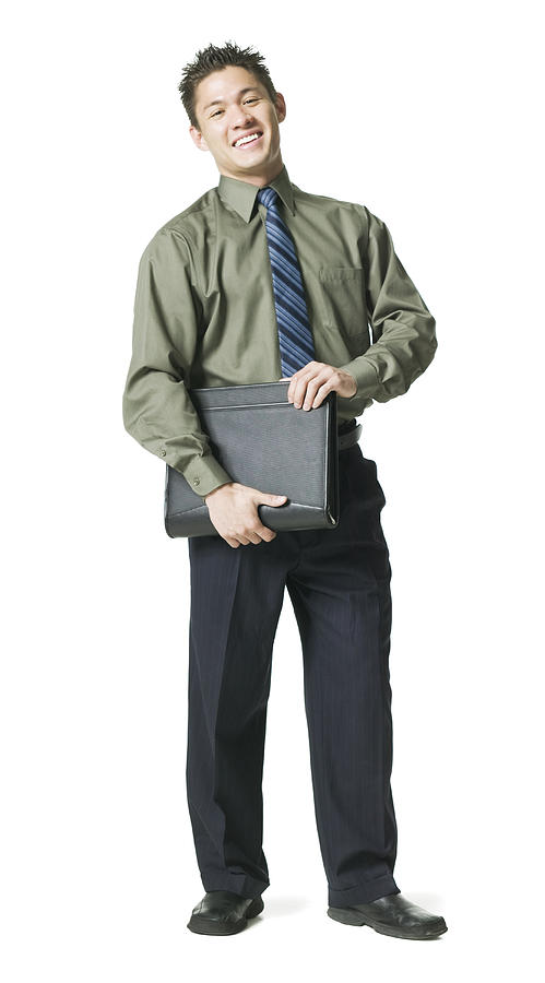 Full Body Shot Of A Young Adult Business Man In A Green Shirt As He Smiles Photograph by Photodisc