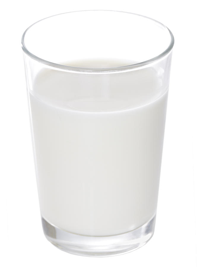 Full clear glass of white milk Photograph by Trigga
