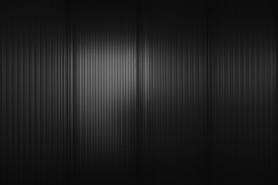 Full frame shot of black corrugated wall Photograph by Norman Posselt