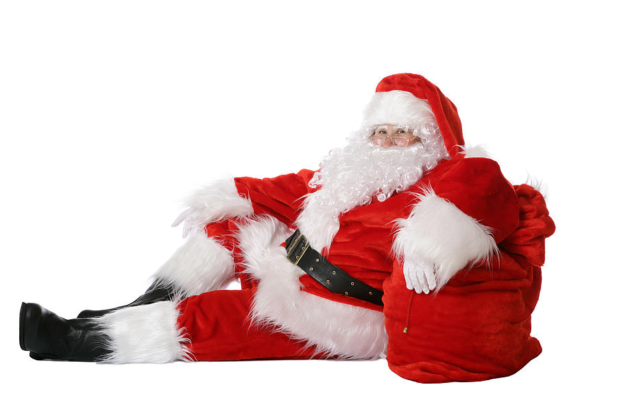Full length of Santa relaxing against his sack of toys Photograph by Cimmerian