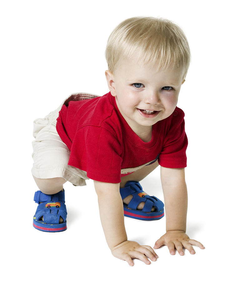 Full Length Shot Of A Blonde Haired Baby Boy In A Red Shirt As He Crawls Photograph by Photodisc