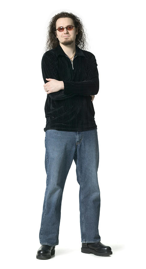 Full Length Shot Of A Young Adult Male In A Black Shirt And Sunglasses As He Folds His Arms Photograph by Photodisc