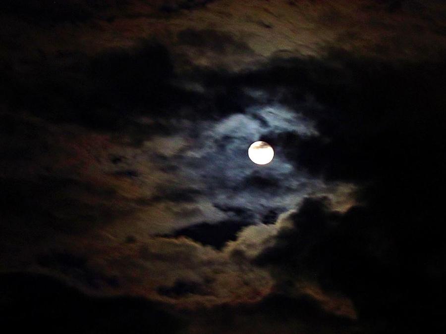 Full Moon Peaking through the Clouds Photograph by Heather Tierney ...