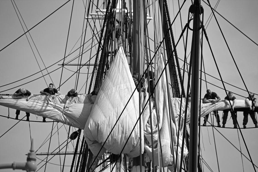Furling the sails Photograph by John Schneider
