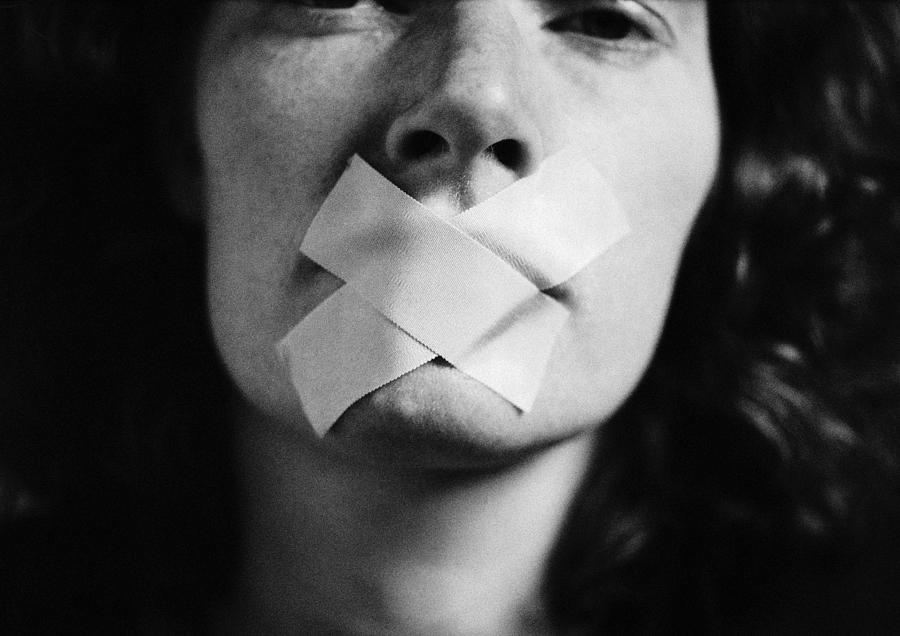Gagged woman, close-up, blurred Photograph by Laurent Hamels