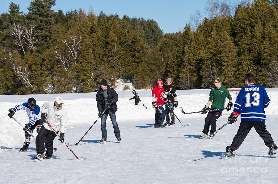 Game of ice hockey on a frozen pond  Photograph by Les Palenik