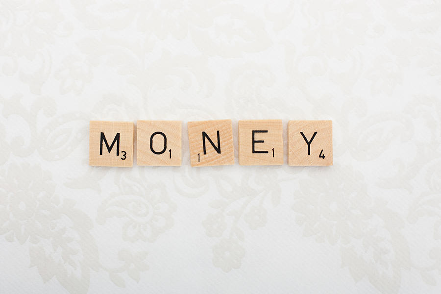 Game tile letters spelling money Photograph by Image Source