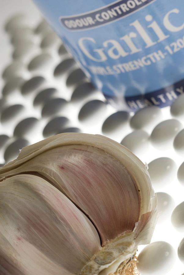 Garlic Cloves And Supplements Photograph by Steve Horrell/science Photo Library