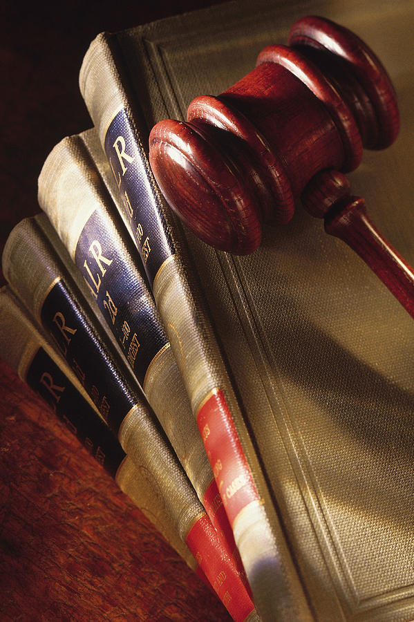 Gavel on top of legal books Photograph by Comstock